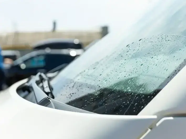 auto glass technician fixing rock chip near Redmond Town Center