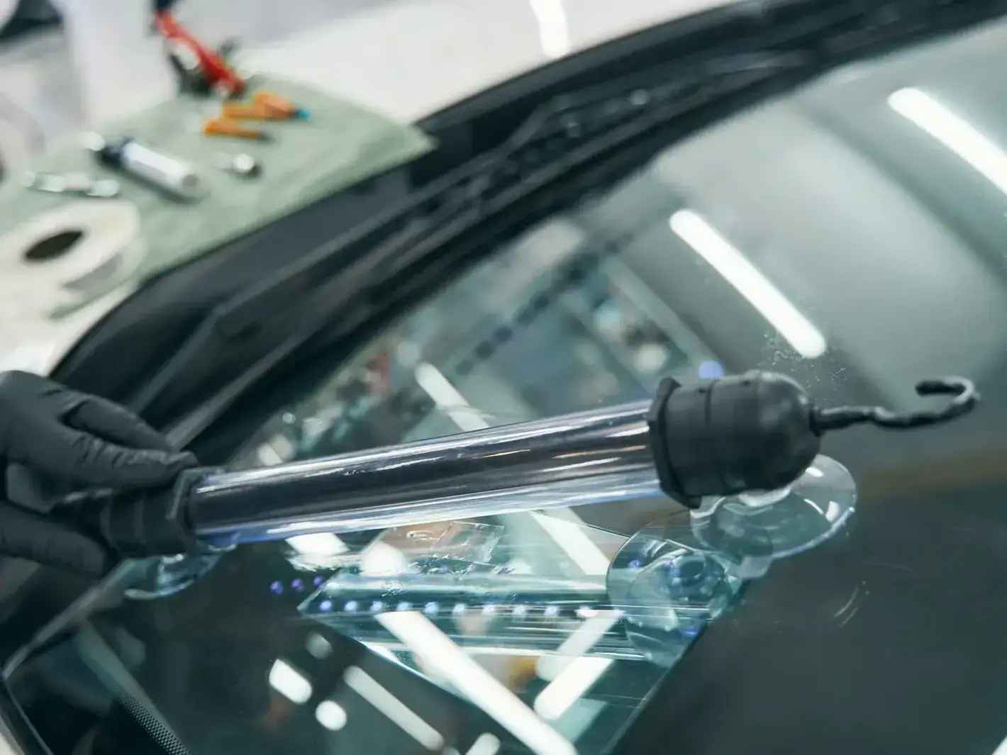 auto glass technician fixing rock chip damage in Downtown Edmonds historic district