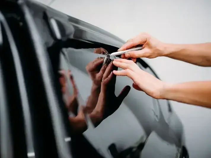 mobile windshield repair technician in Downtown Bellevue office parking lot near Meydenbauer Center