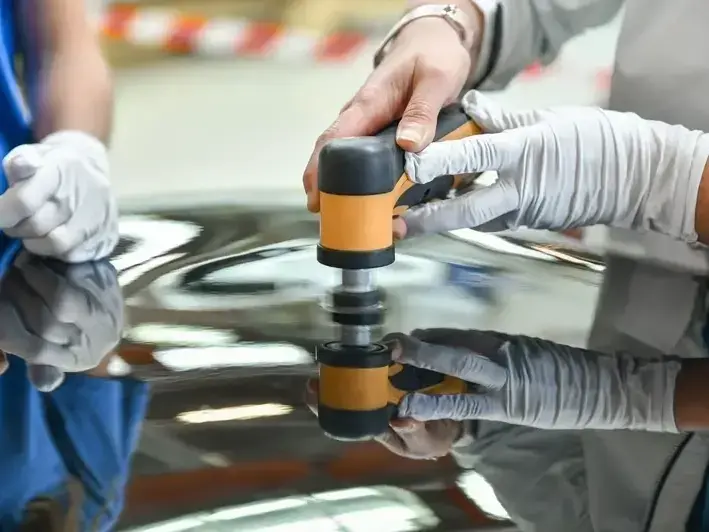 Bellevue windshield repair service vehicle near Bellevue Downtown Park on a wet winter day