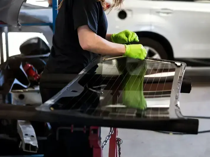 auto glass technician fixing a rock chip before an I-90 commute from Mercer Island